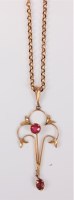 Lot 478 - An early 20th century ruby pendant, the two...