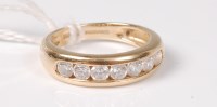 Lot 482 - A 14ct CZ half hoop ring, the seven CZ's...