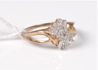 Lot 495 - A 9ct diamond cluster ring, the asymetrical...