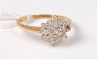 Lot 500 - An 18ct diamond cluster ring, total estimated...