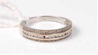 Lot 501 - A 9ct diamond half hoop ring, the three rows...