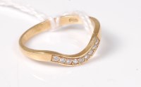 Lot 507 - An 18ct wishbone style diamond ring, the...