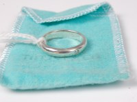 Lot 525 - A Tiffany & Co. silver ring set with a single...