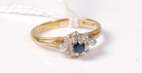 Lot 527 - An 18ct sapphire and diamond cluster ring,...