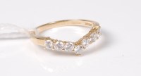 Lot 537 - A 14ct CZ wishbone ring, the round CZ's all...