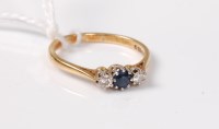 Lot 541 - An 18ct sapphire and diamond ring, the round...