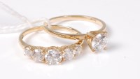 Lot 545 - Two 14ct CZ rings, a single stone CZ ring and...