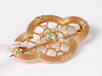 Lot 549 - A 9ct peridot and pearl brooch, the central...