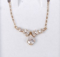 Lot 561 - A 9ct and CZ necklace, the CZ's set in yellow...