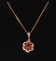 Lot 563 - A 9ct garnet cluster pendant on 9ct chain, (2.9g)