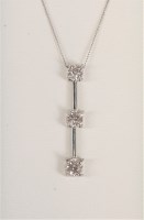 Lot 569 - A 9ct three stone diamond pendant, the three...