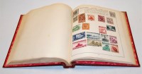 Lot 586 - An early 20th century stamp album and contents,...