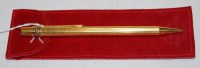 Lot 593 - A Cartier gold plated ballpoint pen, of fluted...