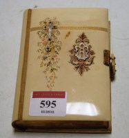 Lot 595 - A circa 1900 faux ivory and gilt pique book...