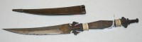 Lot 629 - An Eastern ceremonial dagger, having a curved...