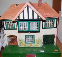 Lot 864 - A mid 1950s Triang two storey dolls house,...