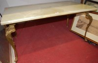 Lot 1080 - A gilt metal and onyx topped coffee table