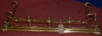 Lot 1129 - An Art Nouveau brass kerb fender, width 123cm