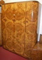 Lot 1136 - An Art Deco figured walnut bedroom suite...