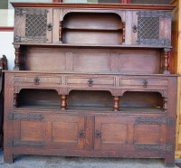 Lot 1156 - An Arts & Crafts oak and iron bound dresser,...