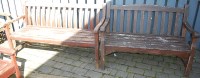 Lot 1168 - A stained teak slatted three seater garden...