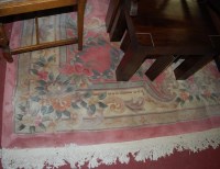 Lot 1185 - A modern Chinese pink ground Superwash carpet...