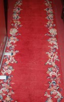 Lot 1188 - A pair of European red ground woollen hall...