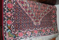 Lot 1197 - An Iranian heavy floral decorated rug,...