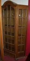 Lot 1205 - An oak single door glazed bookcase, of...