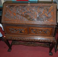 Lot 1214 - A Cantonese relief carved camphor wood...