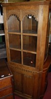 Lot 1223 - A linenfold moulded oak freestanding corner...