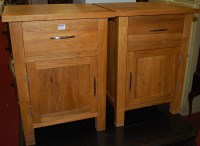 Lot 1239 - A pair of contemporary light oak single door...