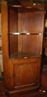 Lot 1257 - A contemporary moulded oak low oak corner...