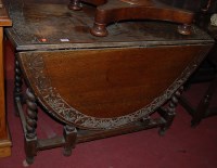 Lot 1290 - An early 20th century line carved oak dropleaf...