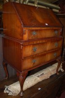 Lot 1291 - A reproduction mahogany slopefront three...