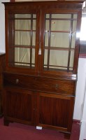 Lot 1311 - An early 19th century mahogany secretaire...