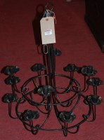 Lot 1320 - A wrought metal hanging two-tier ceiling light,...