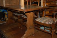 Lot 1333 - A contemporary moulded oak dining suite,...