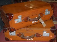 Lot 1340 - A pair of tan leather suitcases, having...