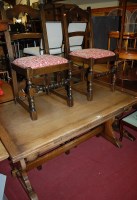 Lot 1345 - A 17th century style moulded oak dining suite,...