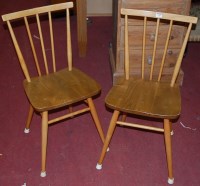 Lot 1385 - A pair of Ercol light elm stickback kitchen...