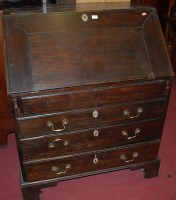 Lot 1425 - A circa 1800 provincial oak slopefront writing...