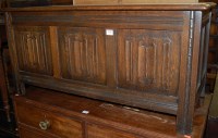 Lot 1426 - A moulded oak linenfold three panelled hinge...