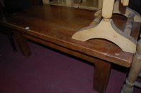 Lot 1441 - A contemporary oak coffee table having cleated...