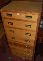 Lot 1444 - A pine and plywood chest of seven long drawers...