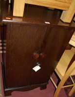 Lot 1454 - A 1930s oak double door record cabinet, width...