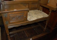 Lot 1459 - A contemporary moulded oak telephone seat with...