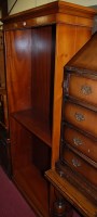 Lot 1467 - A reproduction yew wood freestanding open...