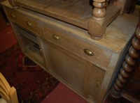 Lot 1476 - A Victorian pine dresser base, having twin...