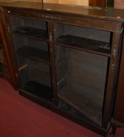 Lot 1480 - A moulded oak freestanding open bookshelf,...